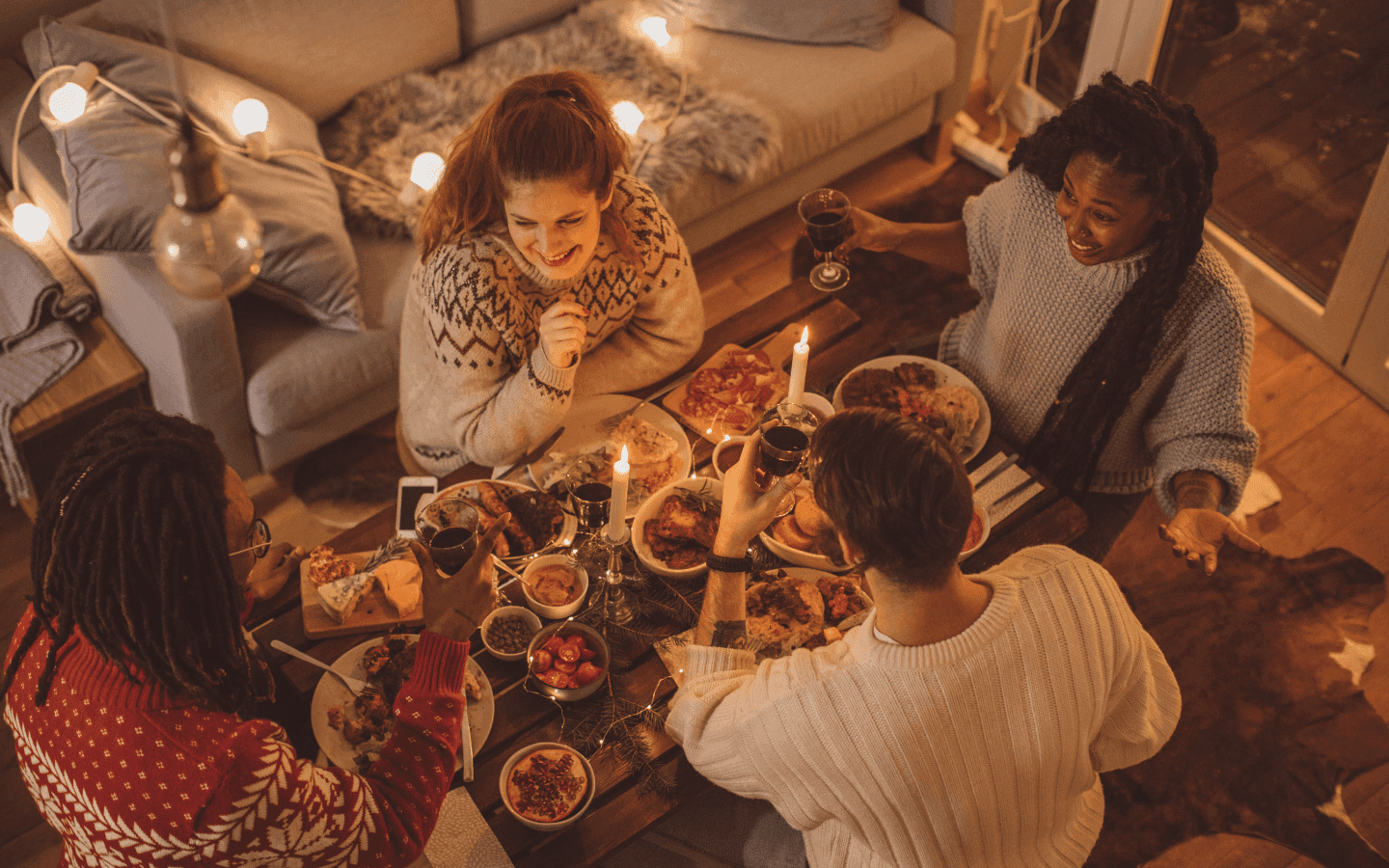 Friends at a dinner party eating and socializing
